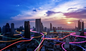 holographic depiction of data transmitting through a city via FTTx networks 