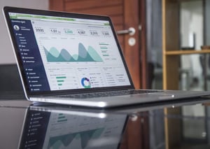 Up-close view of some data charts on a laptop screen